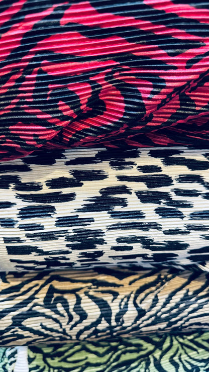 Exotic animal print leopard and zebra design print on pleated poly spandex fabric 58/60” Sold by the YD. Ships Worldwide from Los Angeles CA