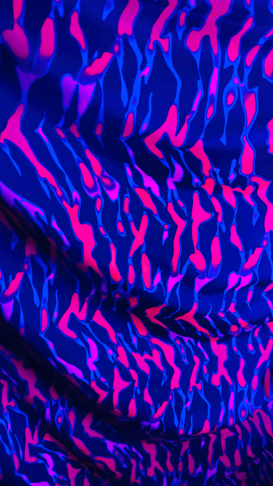 New UV light reflective Tiger abstract design Neon Pink/Black  print on  heavy nylon spandex 4-way stretch 58/60” Sold by the YD.