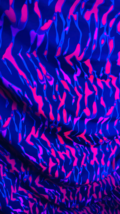 New UV light reflective Tiger abstract design Neon Pink/Black  print on  heavy nylon spandex 4-way stretch 58/60” Sold by the YD.