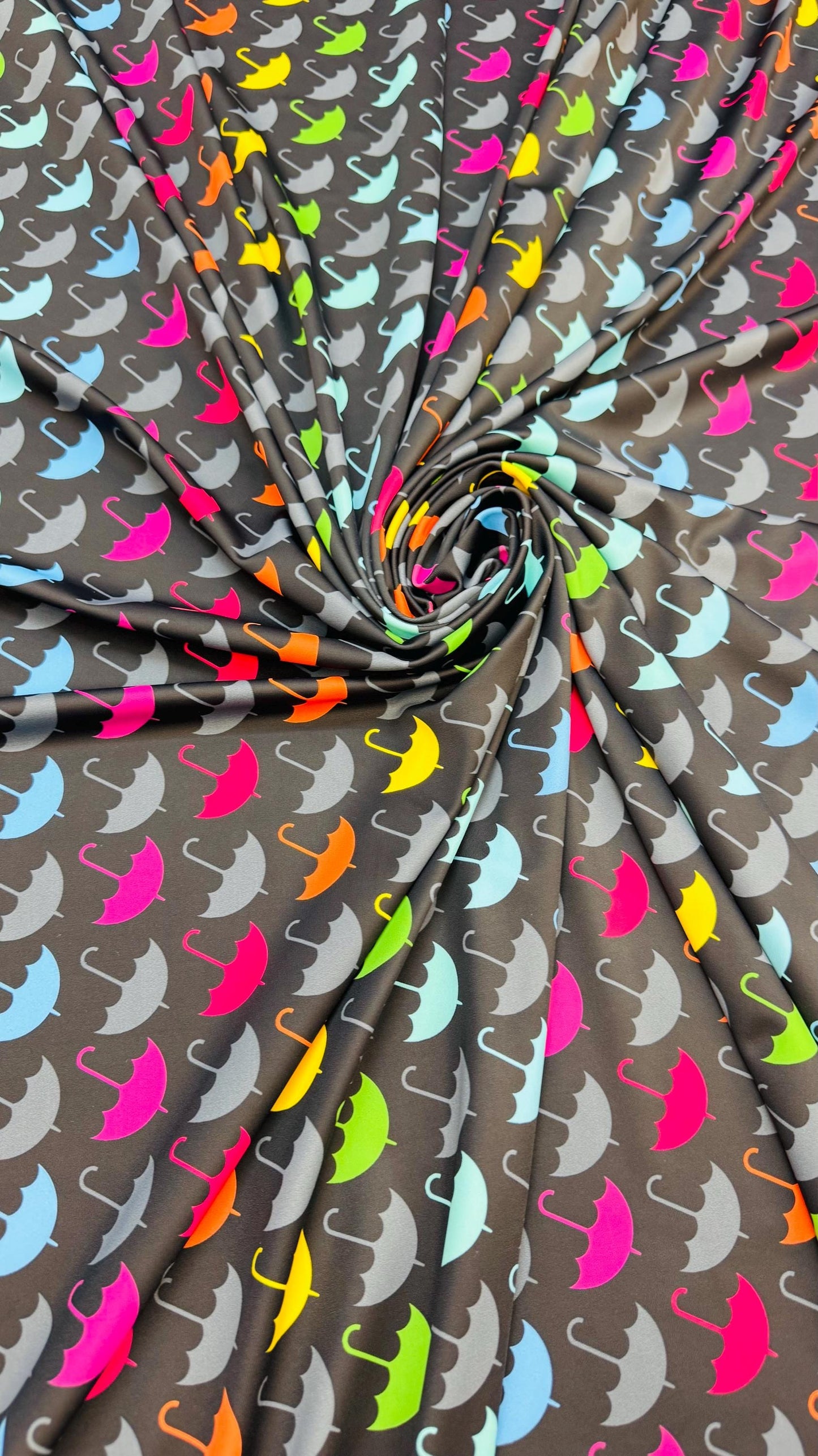 New umbrella multicolor design print on nylon spandex 4-way stretch navy/multicolor 58/60” Sold by the YD. Ships Worldwide from Los Angeles