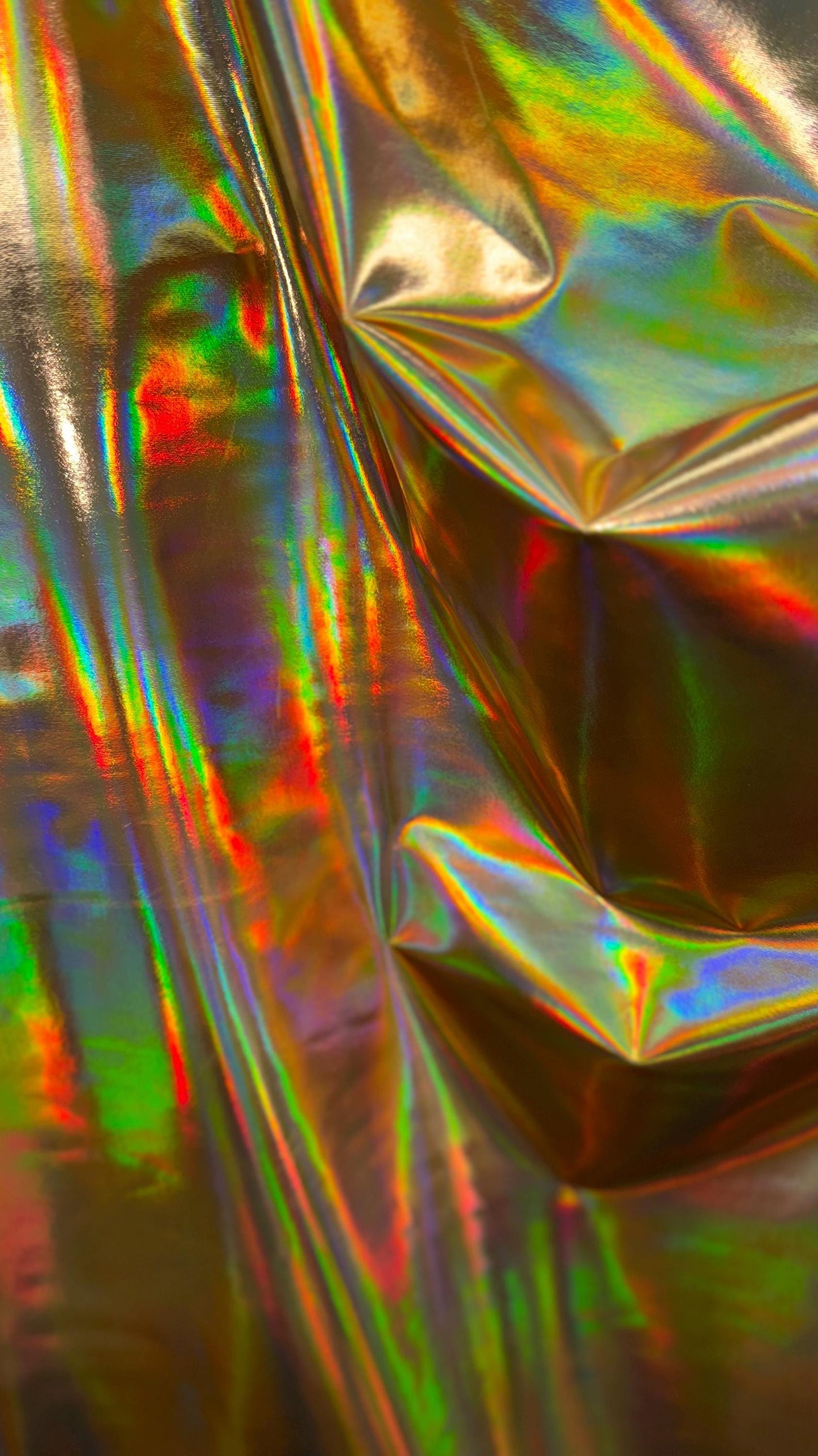 New Iridescent foggy foil oil effect metallic nylon spandex and iridescent metallic vinyl 4way stretch Sold by the YD. Ships worldwide