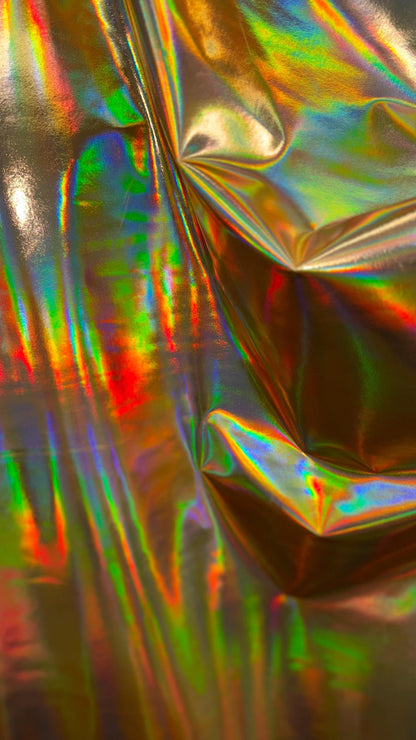 New Iridescent foggy foil oil effect metallic nylon spandex and iridescent metallic vinyl 4way stretch Sold by the YD. Ships worldwide