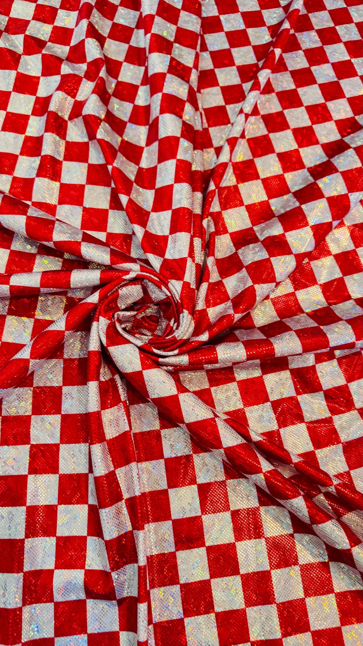 Checkers design 1” size  on shattered glass New metallic hologram nylon spandex 4-way stretch 58/60” Sold by the YD. Ships worldwide