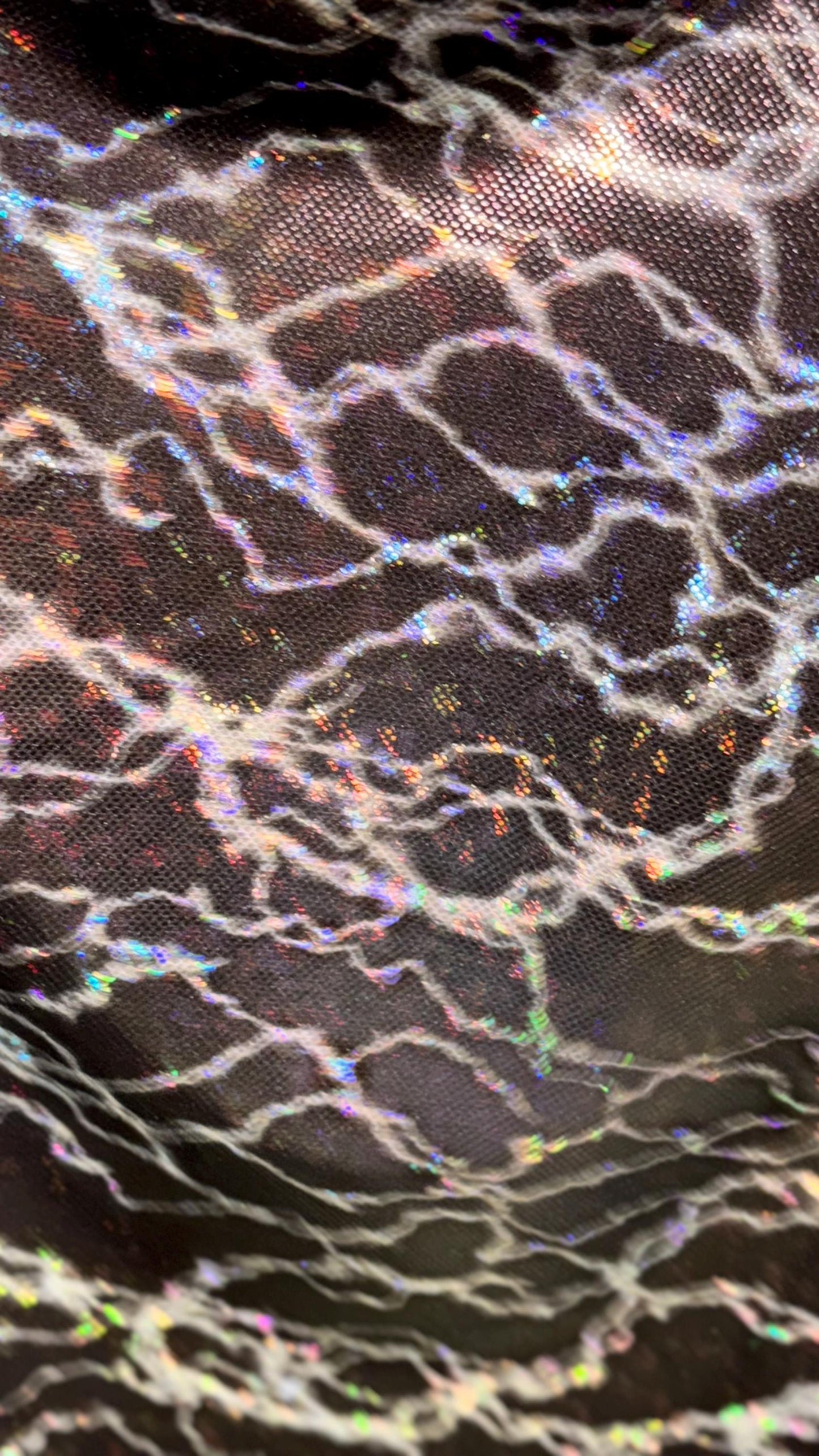 Thunderbolt design on Shattered Glass Hologram Metallic nylon spandex 4way Stretch 58/60" Sold by the YD Ships worldwide from Los Angeles CA