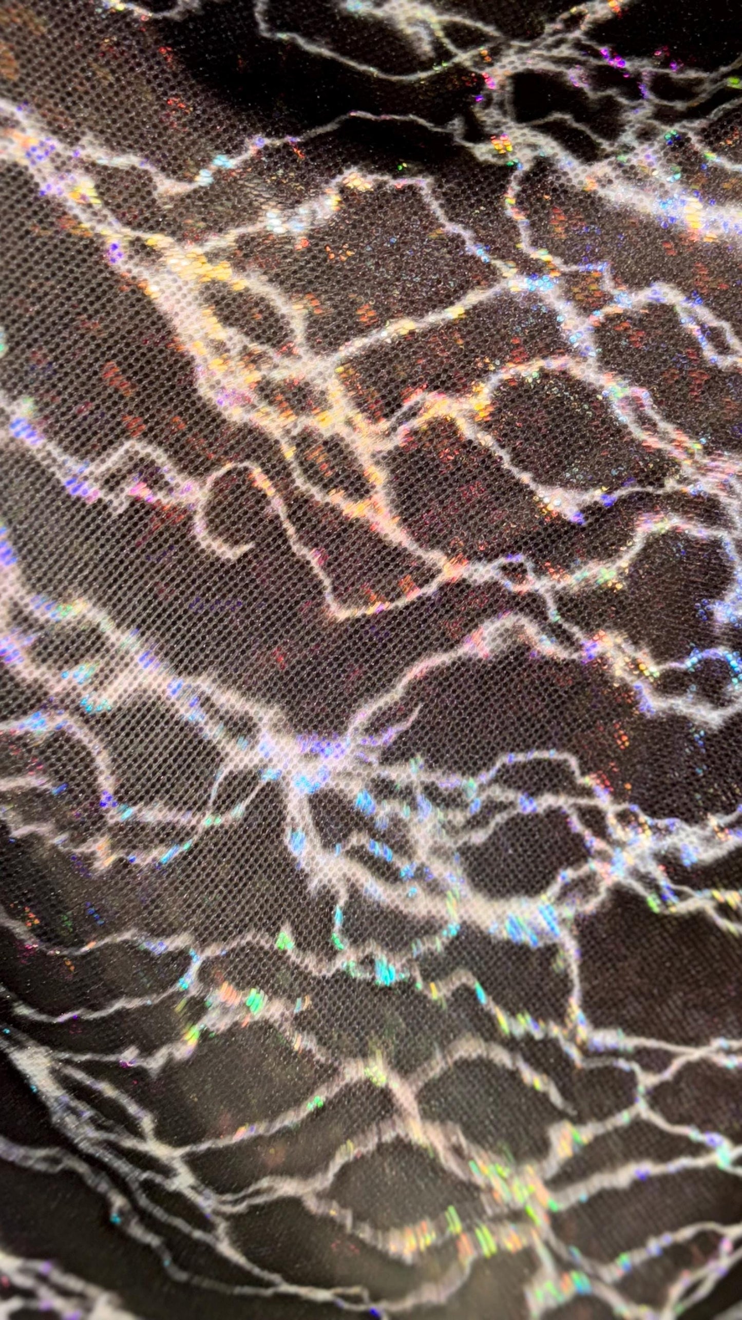 Thunderbolt design on Shattered Glass Hologram Metallic nylon spandex 4way Stretch 58/60" Sold by the YD Ships worldwide from Los Angeles CA
