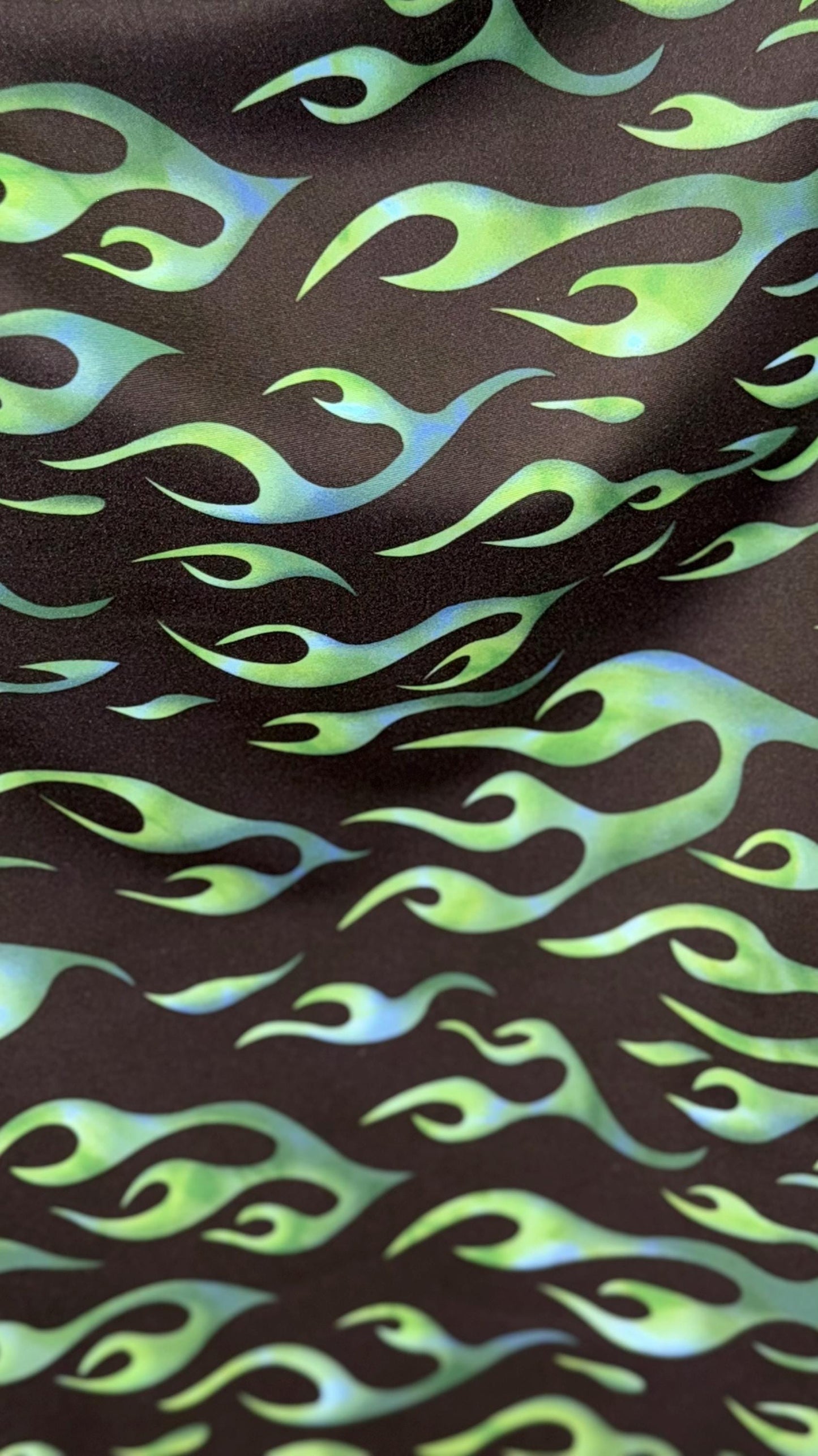 Hot flame design black/Green  print on heavy nylon spandex 4way stretch 58/60" Sold by the YD. Ships worldwide from Los Angeles California