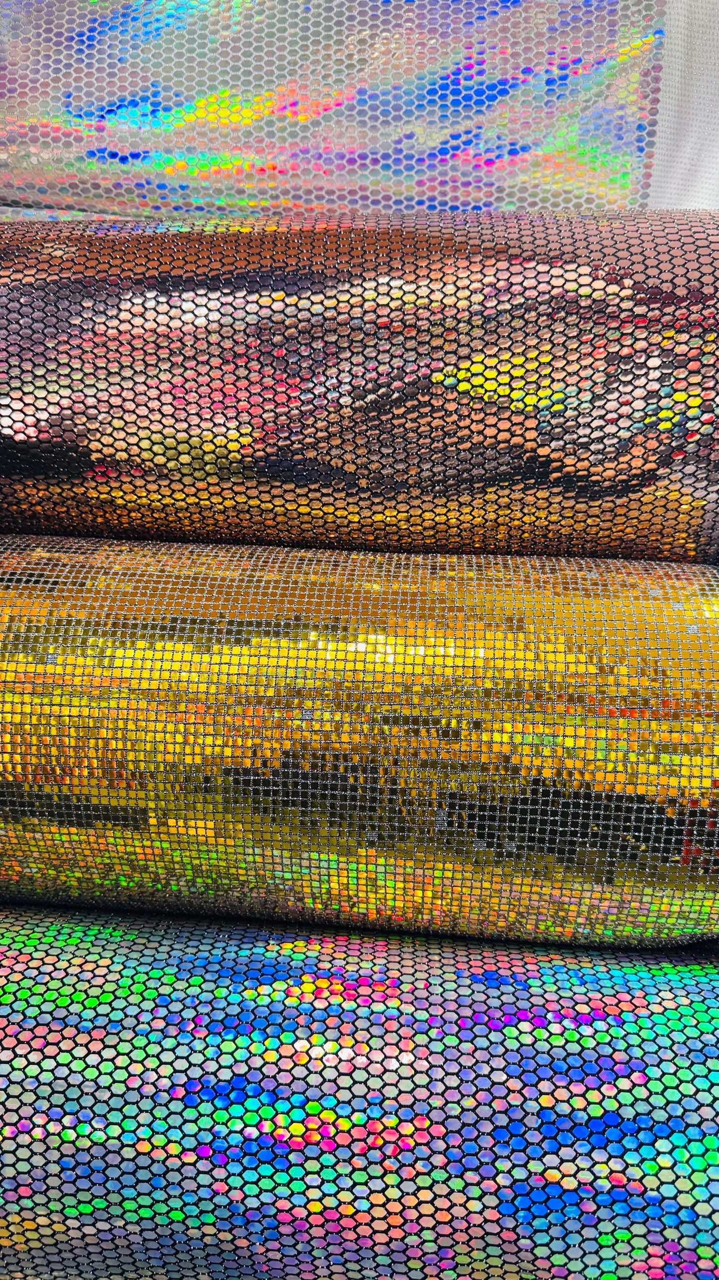 Honeycomb Hologram iridescent sequins trans on Nylon metallic 2-way stretch 58/60” Sold by the YD. Ships worldwide from Los Angeles Californ