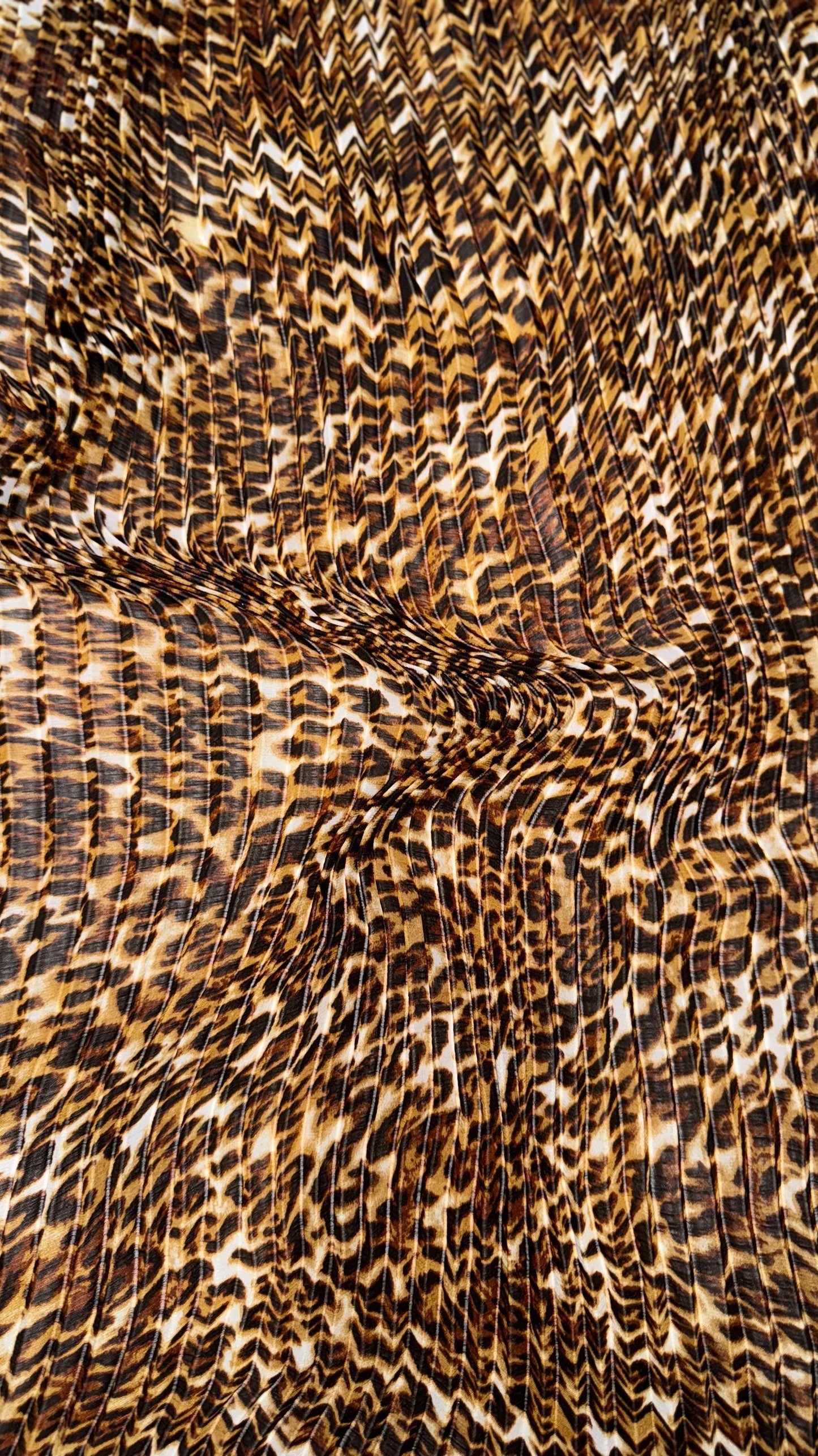 New Exotic leopard design print on high quality of multi chiffon pleated accordion style non stretch 58/60” Sold by the YD. Ships Worldwide