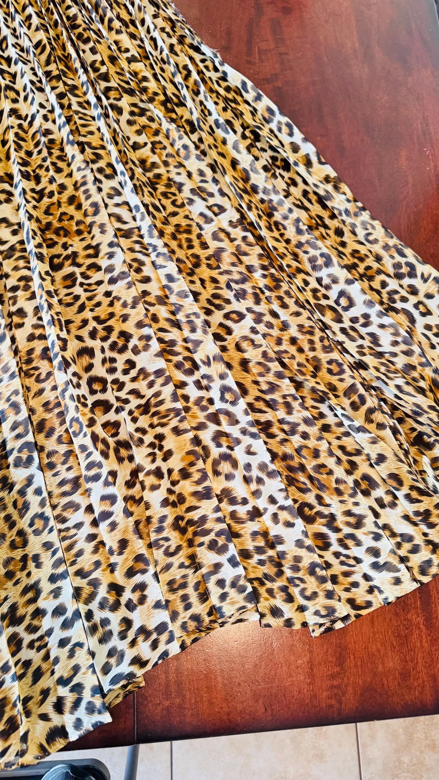 Sunburst pleated Silky Chiffon Cheetah Design non stretch 190” length by 60” width Sold by the PC. Ships worldwide from Los Angeles CA