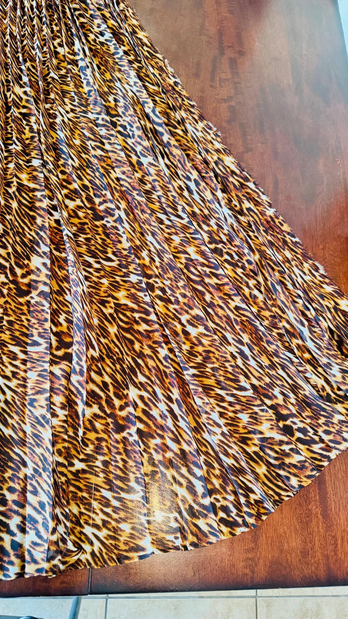 Sunburst pleated Silky Chiffon Leopard Design non stretch 190” length by 60” width Sold by the PC. Ships worldwide from Los Angeles CA