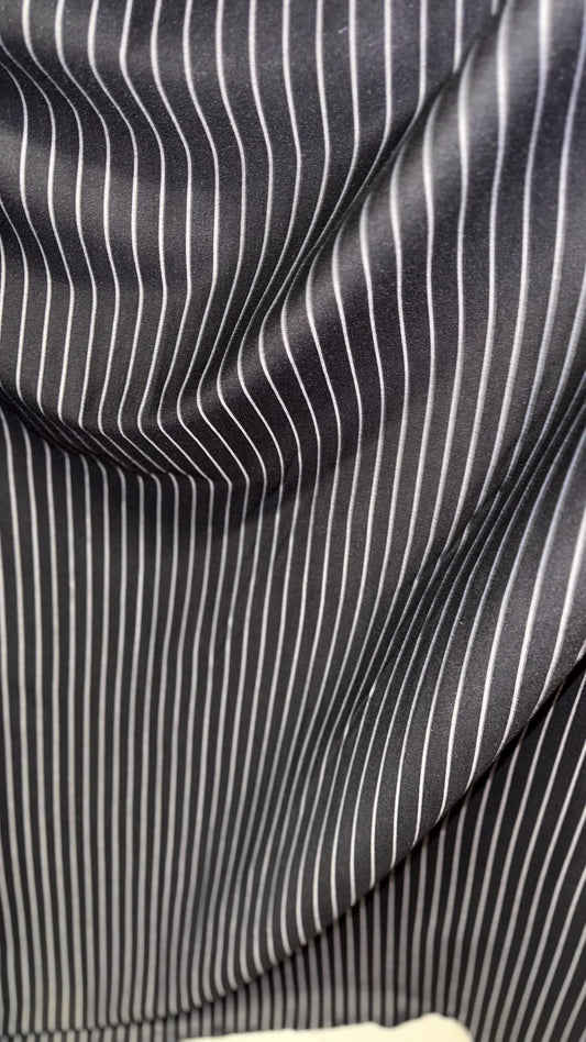 Pin stripes on spandex ponte de Roma fabric  2-way stretch 58/60” Sold by the YD. Ships worldwide from Los Angeles California USA.