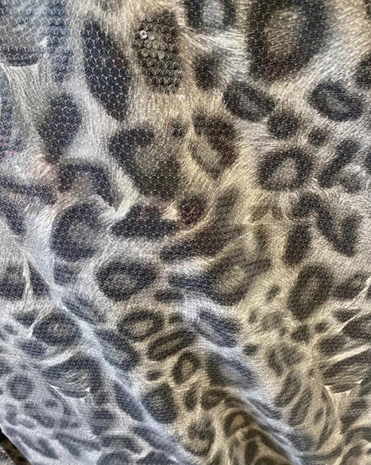 New Exotic leopard design with clear sequins all over nylon base 2-way stretch 58/60” Sold by the YD. Ships worldwide from Los Angeles cali