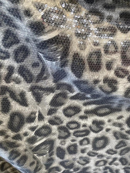 New Exotic leopard design with clear sequins all over nylon base 2-way stretch 58/60” Sold by the YD. Ships worldwide from Los Angeles cali