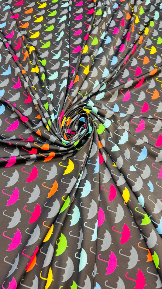New umbrella multicolor design print on nylon spandex 4-way stretch navy/multicolor 58/60” Sold by the YD. Ships Worldwide from Los Angeles