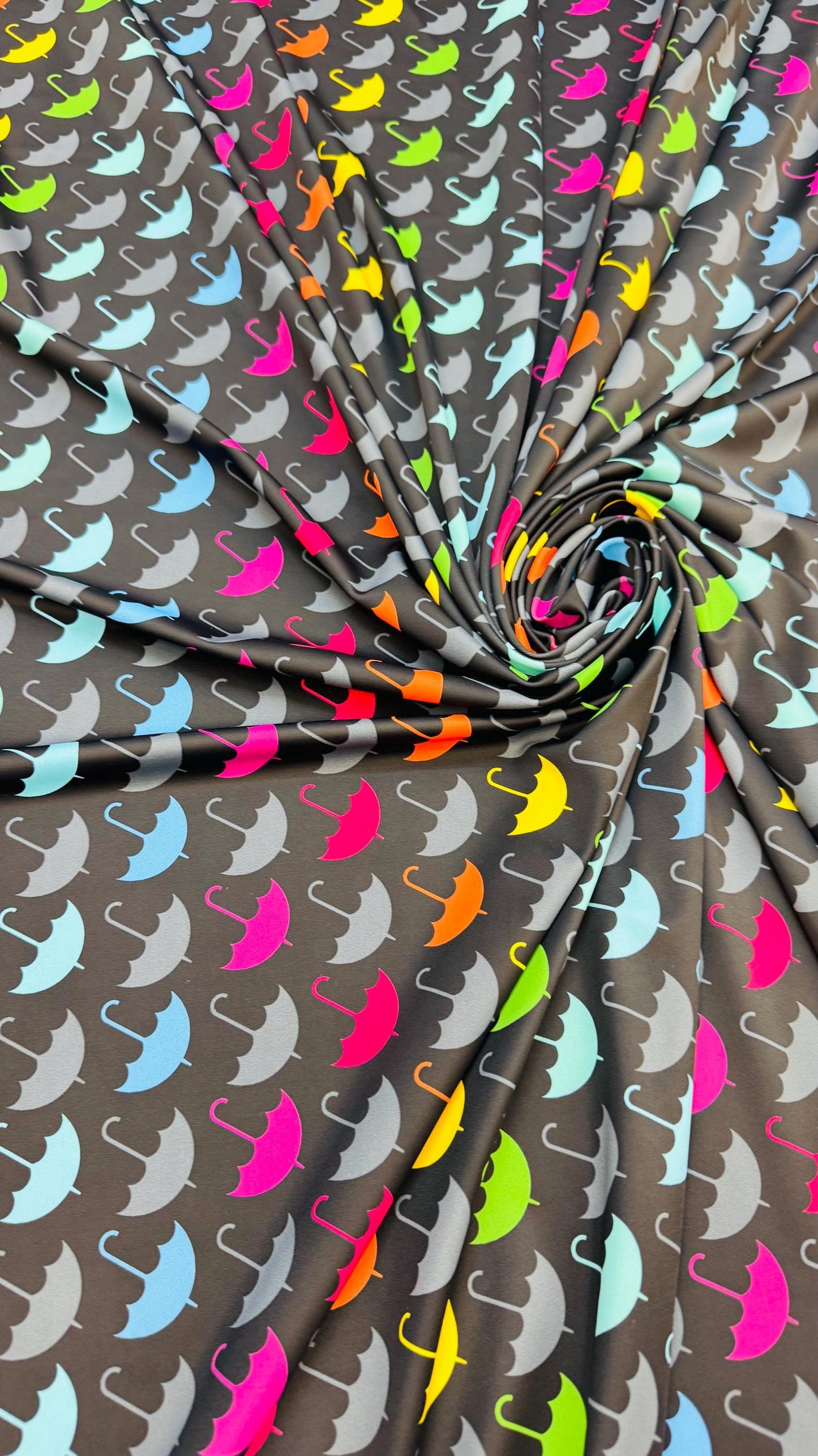 New umbrella multicolor design print on nylon spandex 4-way stretch navy/multicolor 58/60” Sold by the YD. Ships Worldwide from Los Angeles