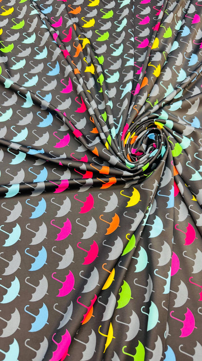 New umbrella multicolor design print on nylon spandex 4-way stretch navy/multicolor 58/60” Sold by the YD. Ships Worldwide from Los Angeles