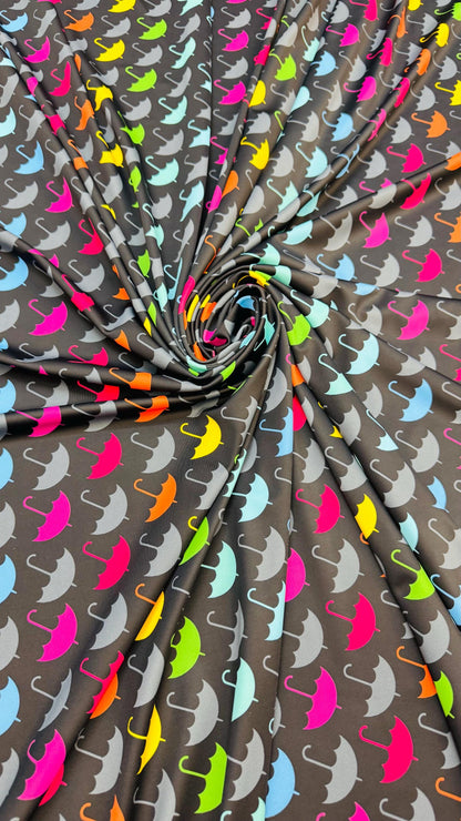 New umbrella multicolor design print on nylon spandex 4-way stretch navy/multicolor 58/60” Sold by the YD. Ships Worldwide from Los Angeles