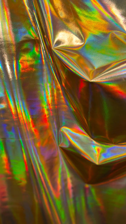 New Iridescent foggy foil oil effect metallic nylon spandex and iridescent metallic vinyl 4way stretch Sold by the YD. Ships worldwide