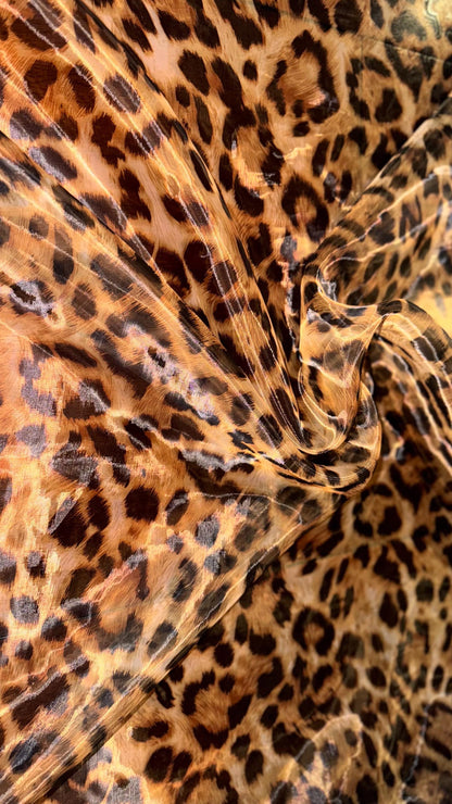 New Exotic Leopard design print on great quality of Mirror Silky Organza non stretch 58/60” Sold by the YD. Ships worldwide from LA CA