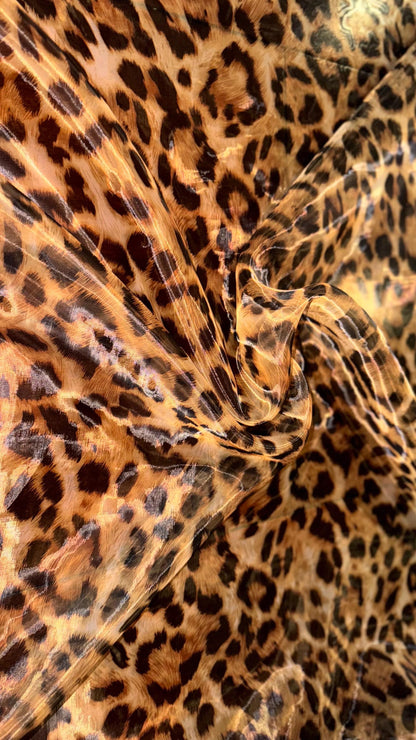 New Exotic Leopard design print on great quality of Mirror Silky Organza non stretch 58/60” Sold by the YD. Ships worldwide from LA CA