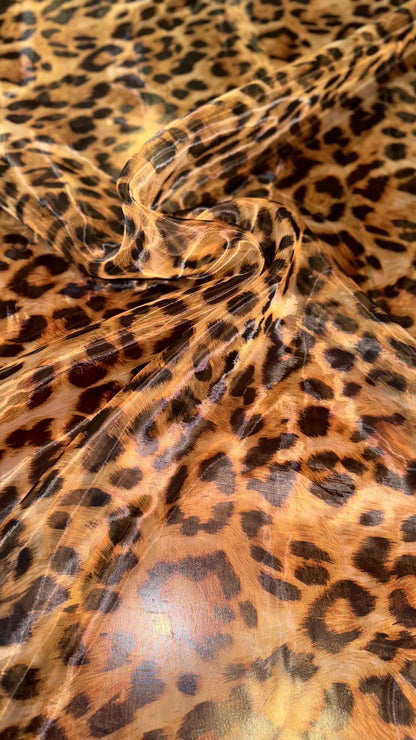 New Exotic Leopard design print on great quality of Mirror Silky Organza non stretch 58/60” Sold by the YD. Ships worldwide from LA CA