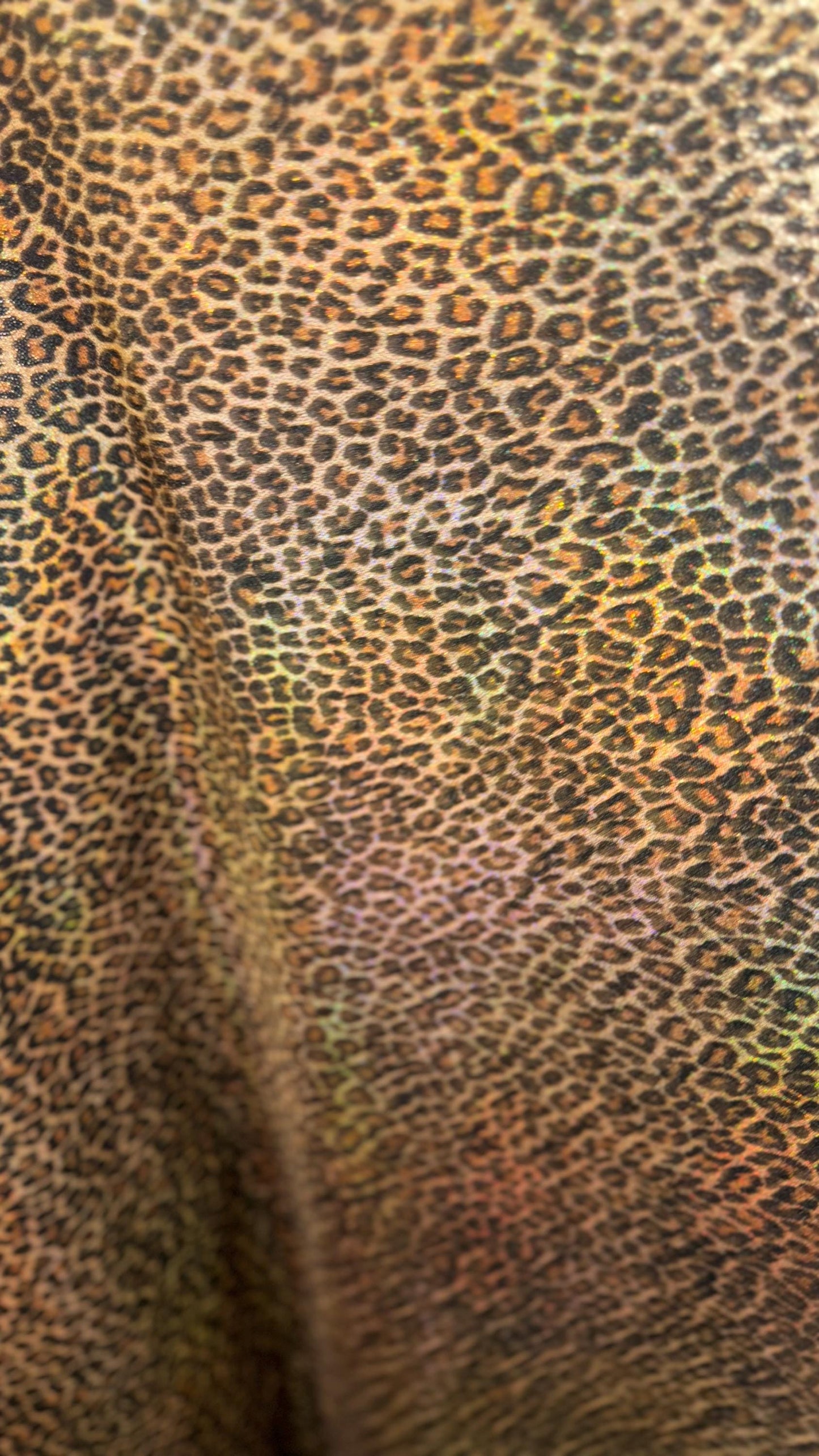 New Exotic cheetah and Leopard design Iridescent metallic hologram nylon spandex 4-way spandex 58/60” Sold by the YD. Ships worldwide
