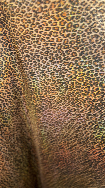 New Exotic cheetah and Leopard design Iridescent metallic hologram nylon spandex 4-way spandex 58/60” Sold by the YD. Ships worldwide