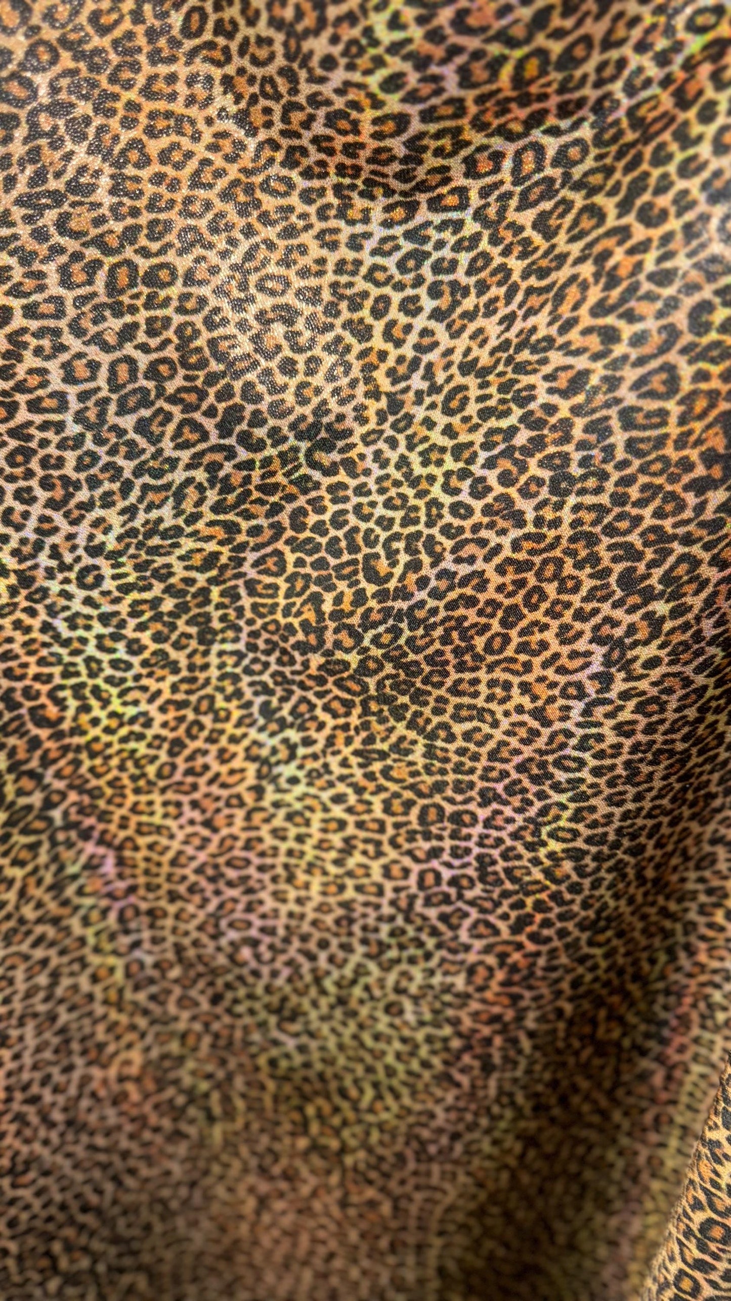 New Exotic cheetah and Leopard design Iridescent metallic hologram nylon spandex 4-way spandex 58/60” Sold by the YD. Ships worldwide