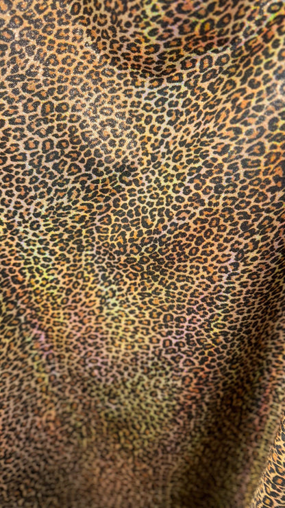 New Exotic cheetah and Leopard design Iridescent metallic hologram nylon spandex 4-way spandex 58/60” Sold by the YD. Ships worldwide