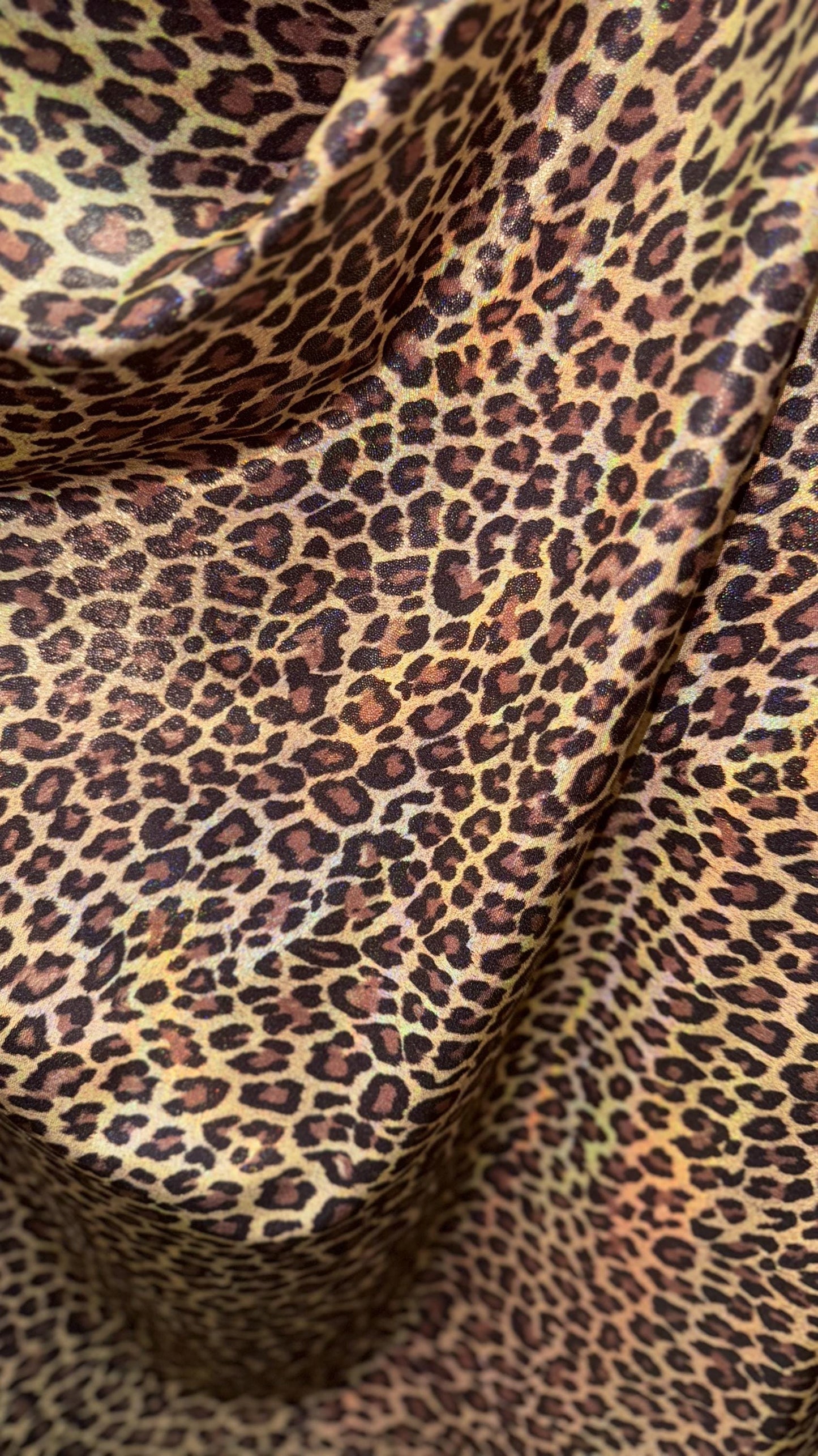 New Exotic cheetah and Leopard design Iridescent metallic hologram nylon spandex 4-way spandex 58/60” Sold by the YD. Ships worldwide