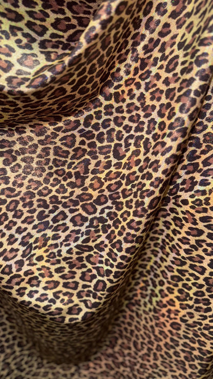 New Exotic cheetah and Leopard design Iridescent metallic hologram nylon spandex 4-way spandex 58/60” Sold by the YD. Ships worldwide