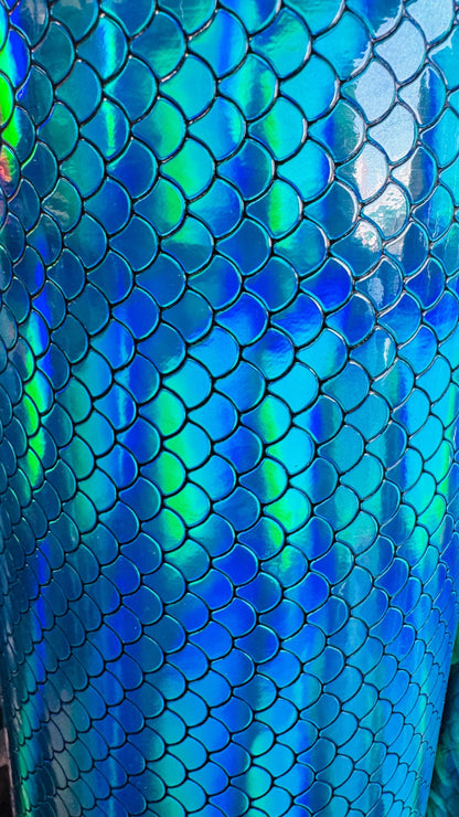 New Exotic Mermaid design super Iridescent vinyl with fish scales 55/56” Sold by the YD. Ships Worldwide from Los Angeles California USA.