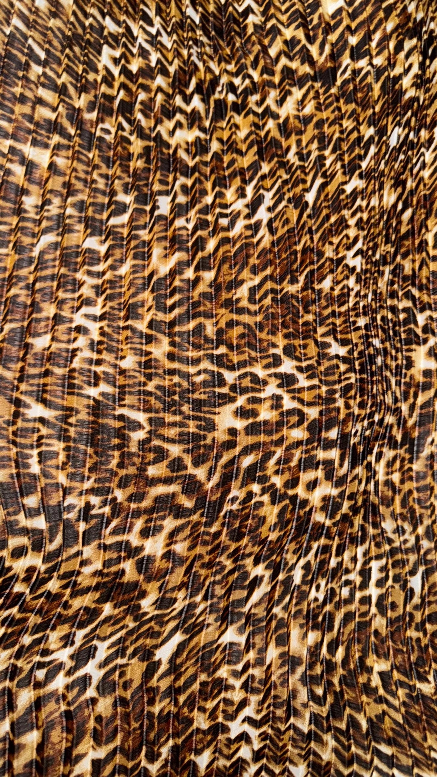 New Exotic leopard design print on high quality of multi chiffon pleated accordion style non stretch 58/60” Sold by the YD. Ships Worldwide