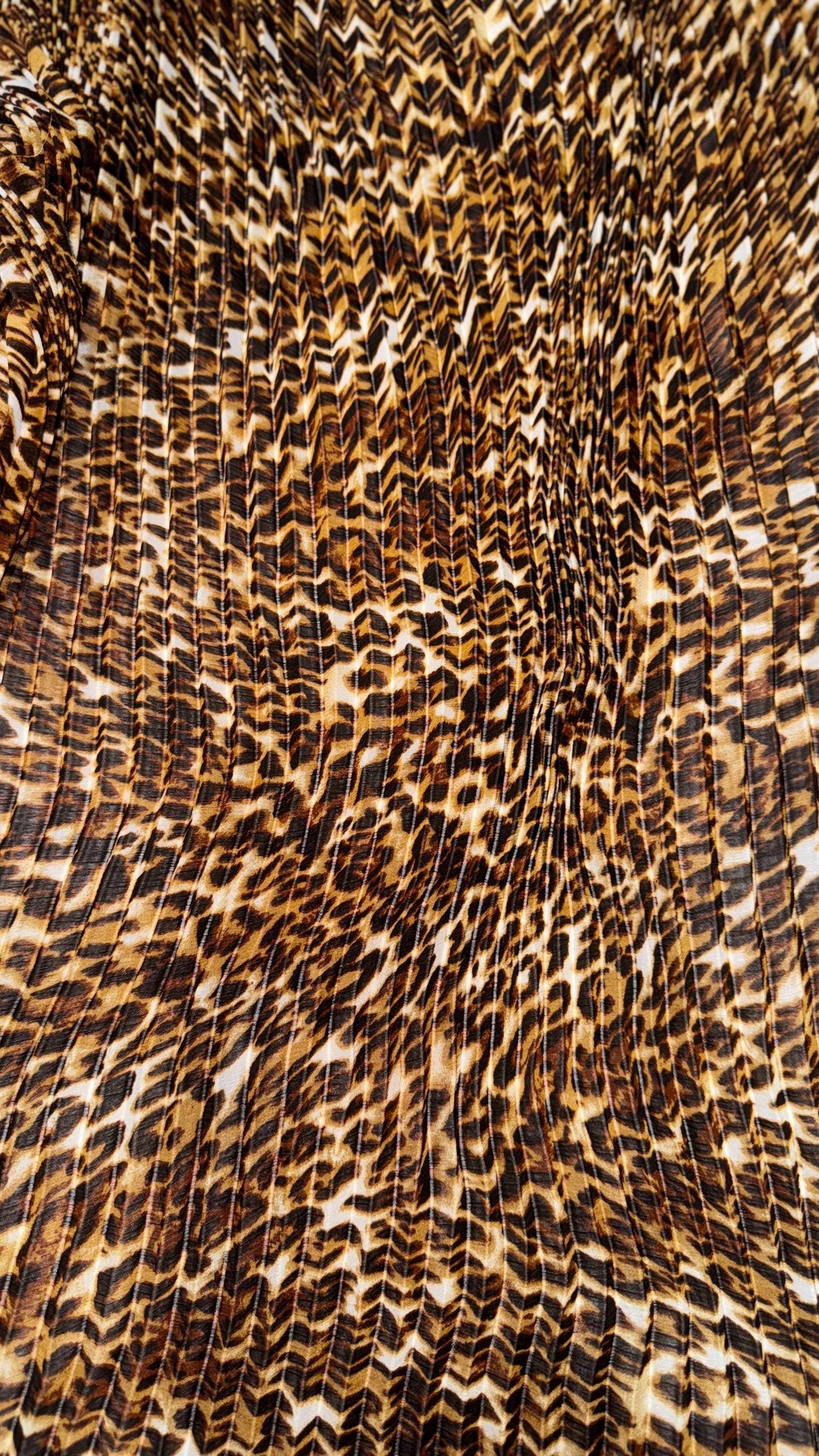 New Exotic leopard design print on high quality of multi chiffon pleated accordion style non stretch 58/60” Sold by the YD. Ships Worldwide