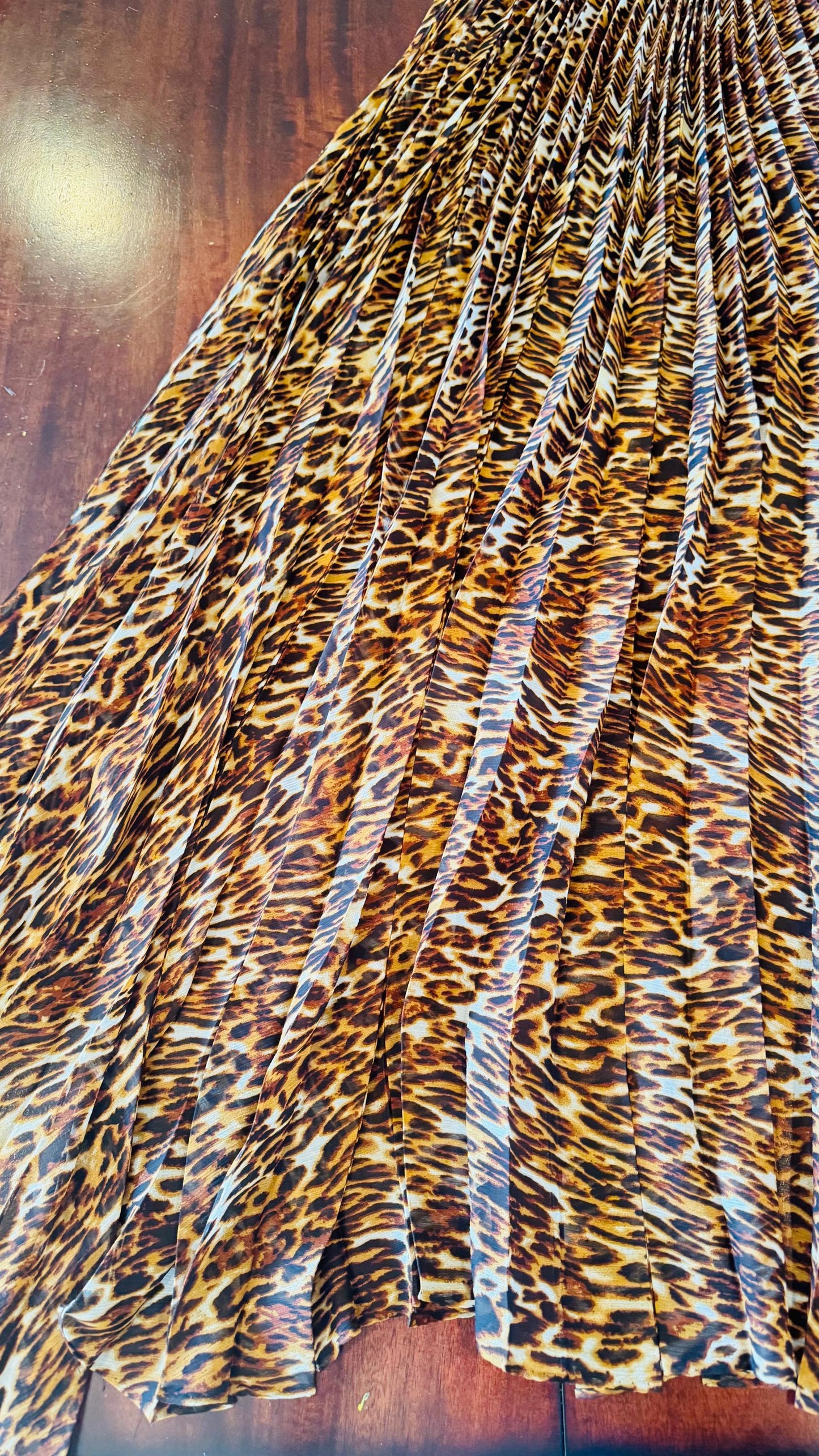 Sunburst pleated Silky Chiffon Leopard Design non stretch 190” length by 60” width Sold by the PC. Ships worldwide from Los Angeles CA