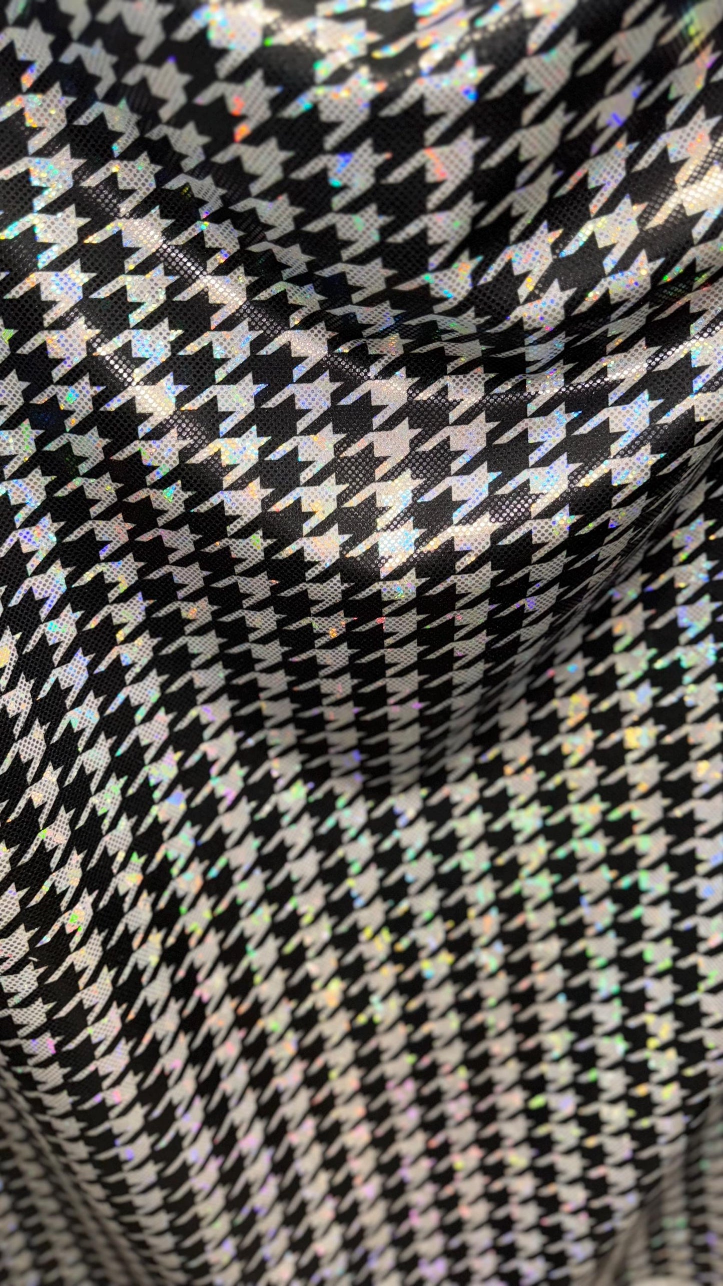Houndstooth design on Shattered Glass metallic hologram nylon spandex White/Silver/Black  4-way stretch 58/60" Sold by the YD.