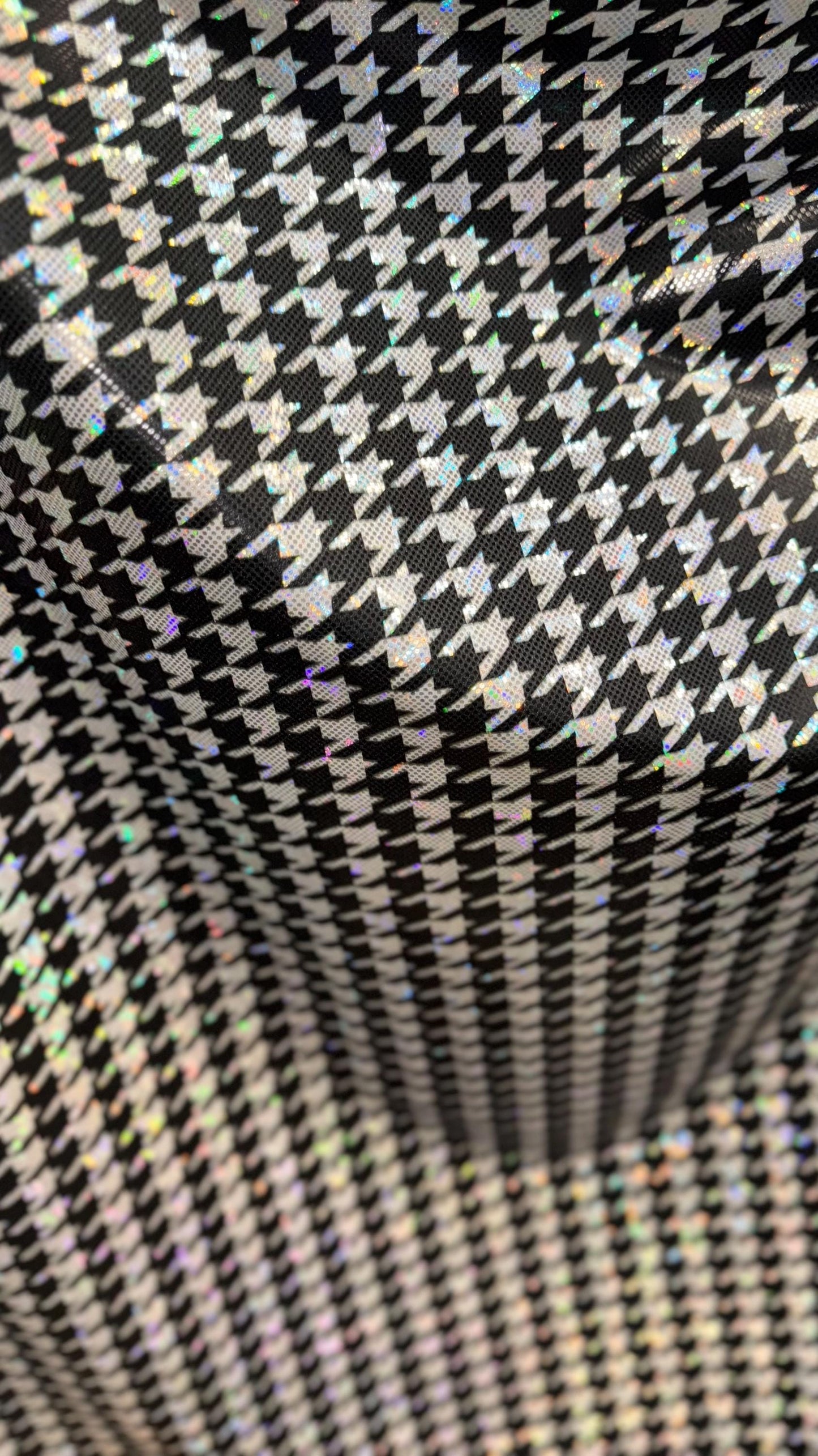 Houndstooth design on Shattered Glass metallic hologram nylon spandex White/Silver/Black  4-way stretch 58/60" Sold by the YD.