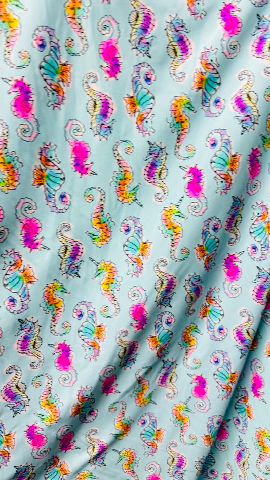 Sea Horse design Aqua Multi  print on great nylon spandex 4way stretch 58/60" Sold by the yd. Ships worldwide from Los Angeles California