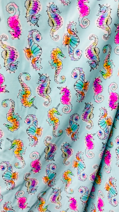 Sea Horse design Aqua Multi  print on great nylon spandex 4way stretch 58/60" Sold by the yd. Ships worldwide from Los Angeles California