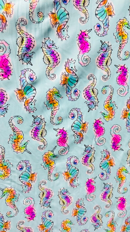 Sea Horse design Aqua Multi  print on great nylon spandex 4way stretch 58/60" Sold by the yd. Ships worldwide from Los Angeles California