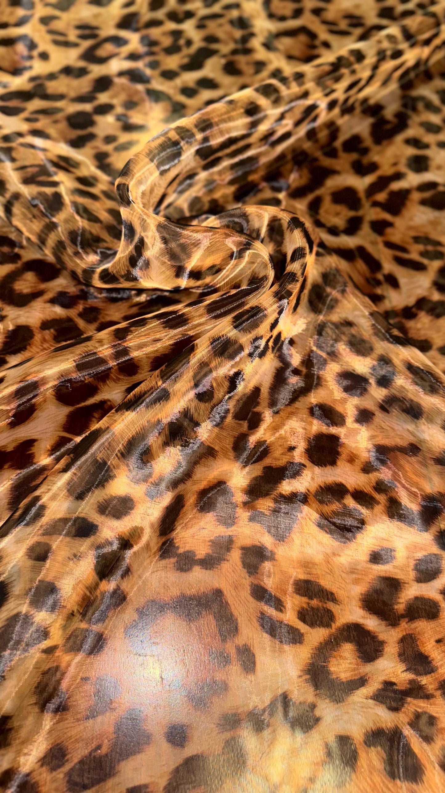 New Exotic Leopard design print on great quality of Mirror Silky Organza non stretch 58/60” Sold by the YD. Ships worldwide from LA CA
