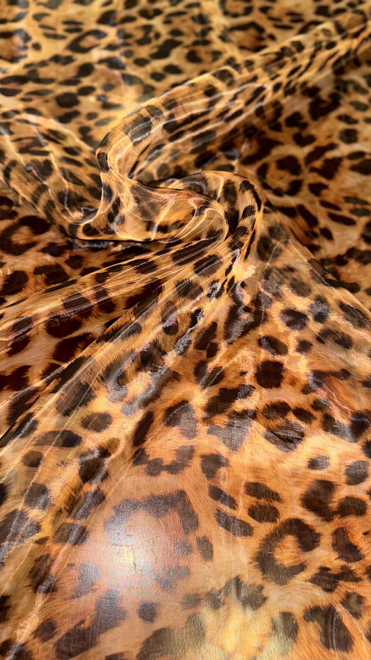 New Exotic Leopard design print on great quality of Mirror Silky Organza non stretch 58/60” Sold by the YD. Ships worldwide from LA CA