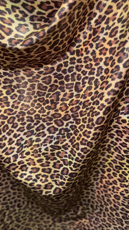 New Exotic cheetah and Leopard design Iridescent metallic hologram nylon spandex 4-way spandex 58/60” Sold by the YD. Ships worldwide