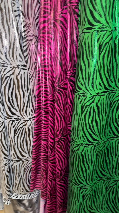 Exotic Zebra design metallic nylon spandex with all over foil 4-way stretch 58/60” Sold by the YD. Ships worldwide from Los Angeles Californ
