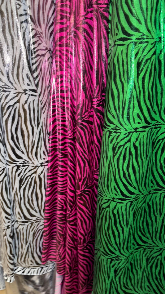 Exotic Zebra design metallic nylon spandex with all over foil 4-way stretch 58/60” Sold by the YD. Ships worldwide from Los Angeles Californ