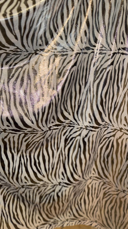 Exotic Zebra design metallic nylon spandex with all over foil 4-way stretch 58/60” Sold by the YD. Ships worldwide from Los Angeles Californ