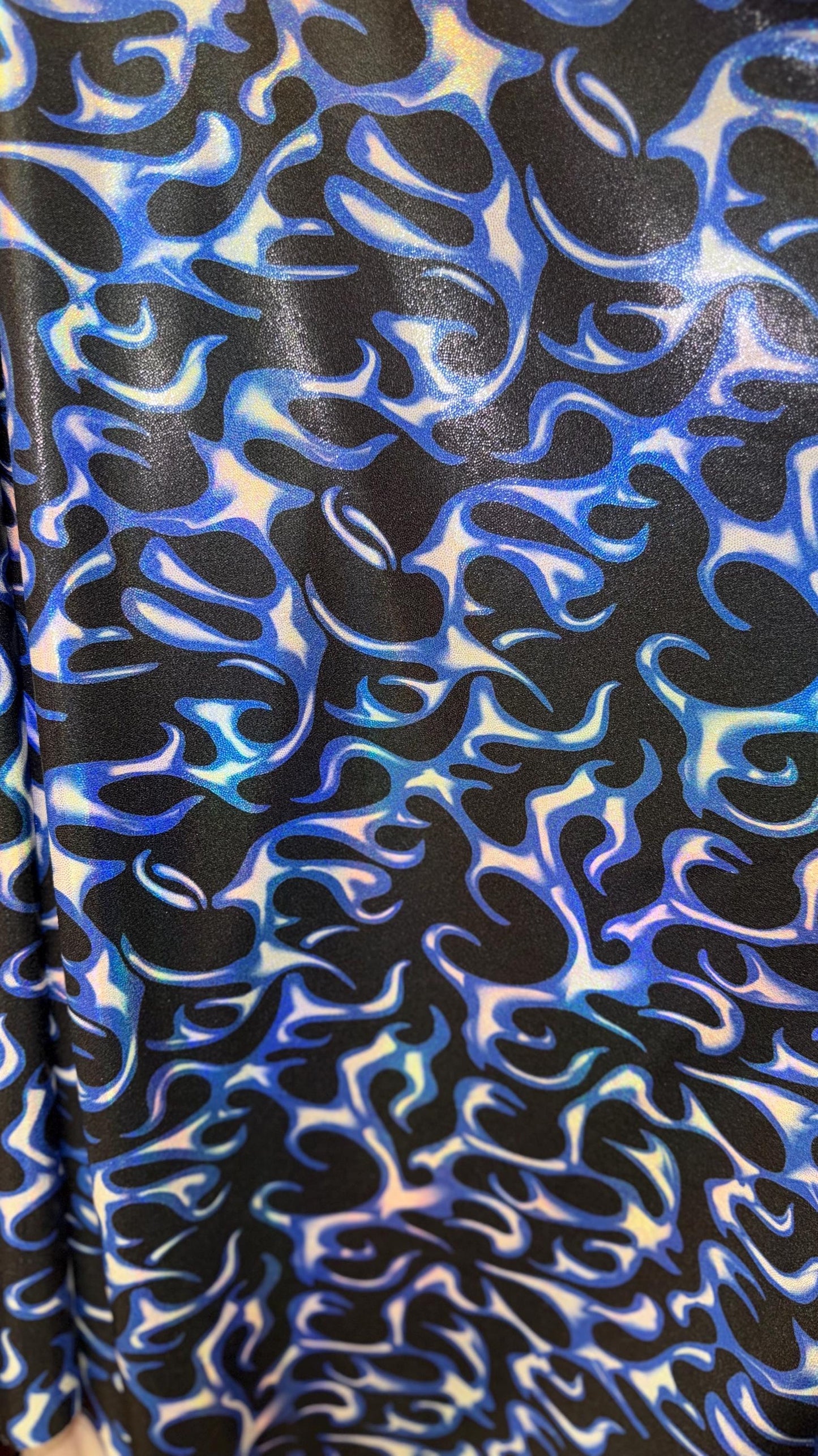 Hot flame design on Iridescent Metallic nylon spandex 4way stretch 58/60" Sold by the YD. Ships worldwide from Los Angeles California USA.