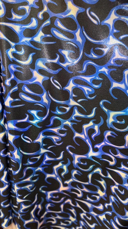 Hot flame design on Iridescent Metallic nylon spandex 4way stretch 58/60" Sold by the YD. Ships worldwide from Los Angeles California USA.