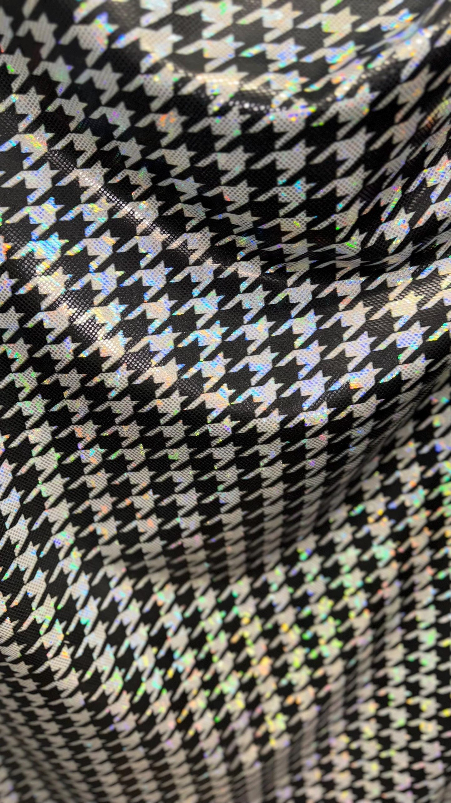 Houndstooth design on Shattered Glass metallic hologram nylon spandex White/Silver/Black  4-way stretch 58/60" Sold by the YD.