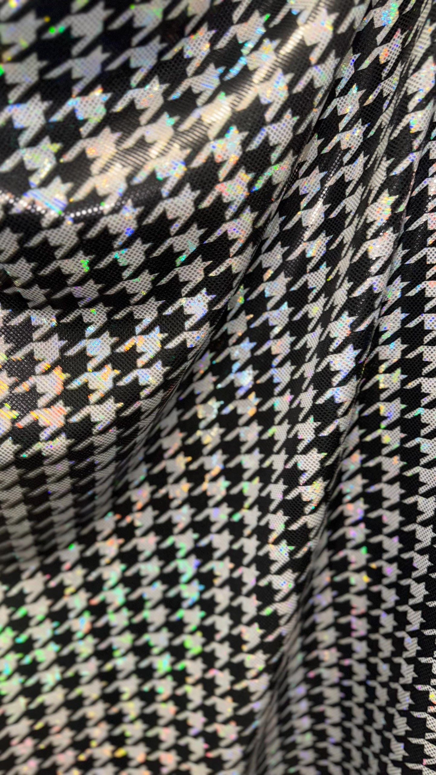 Houndstooth design on Shattered Glass metallic hologram nylon spandex White/Silver/Black  4-way stretch 58/60" Sold by the YD.